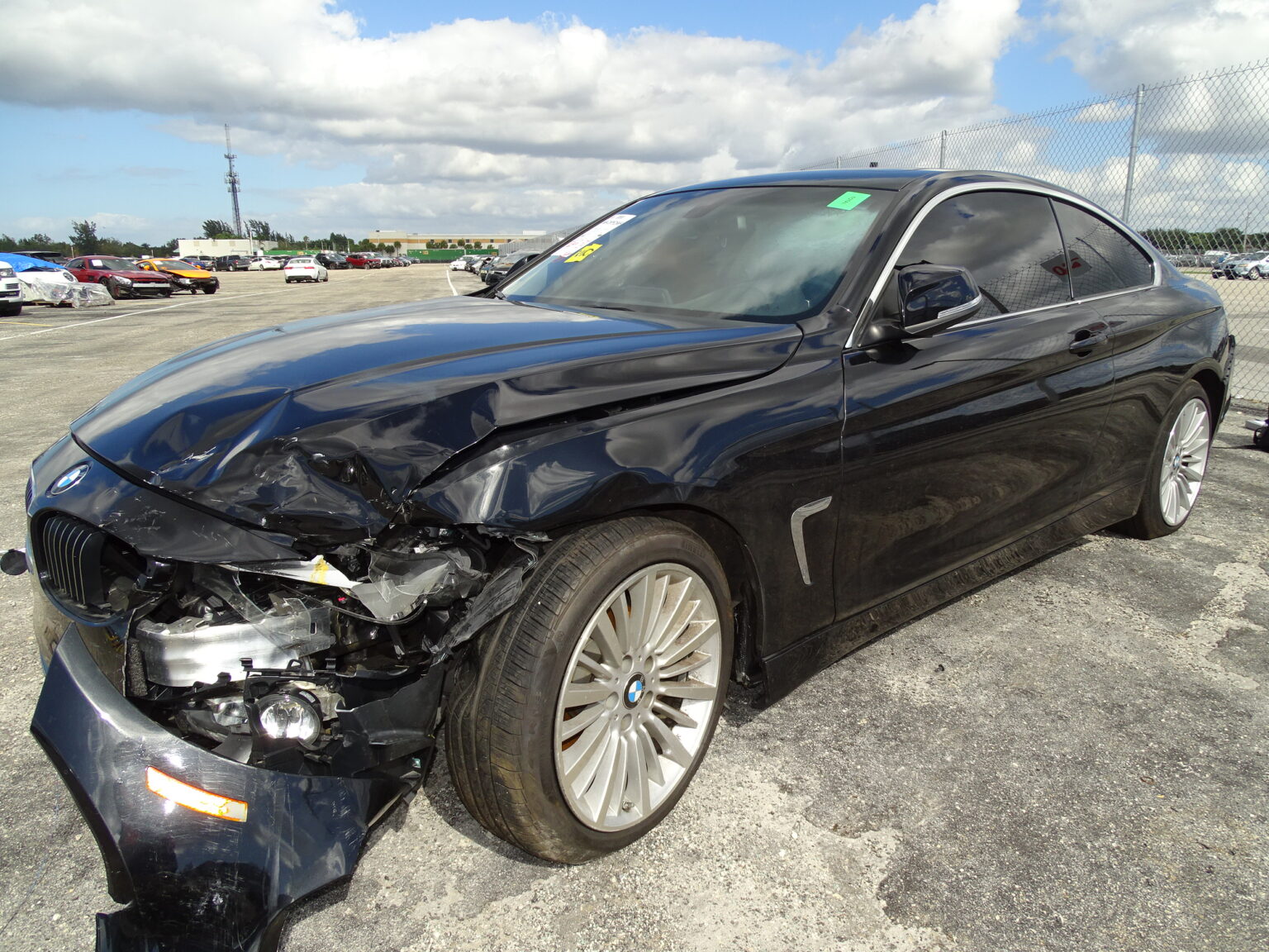 Damaged vehicle being evaluated through the right to appraisal process